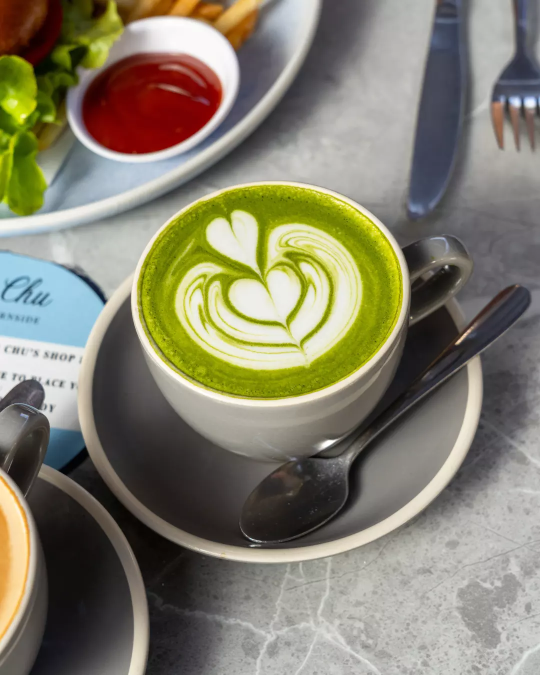 A matcha latte with latte art