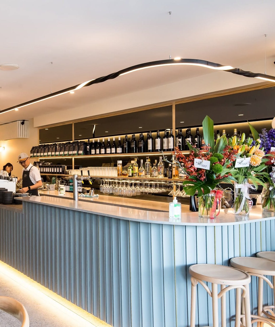 The bar at Mr Chu Norwood, with flowers on the counter